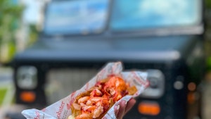 Lobster roll in front of food truck.1
