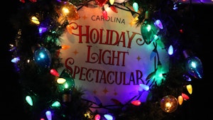 A sign with the logo for the Carolina Holiday Light Spectacular event1