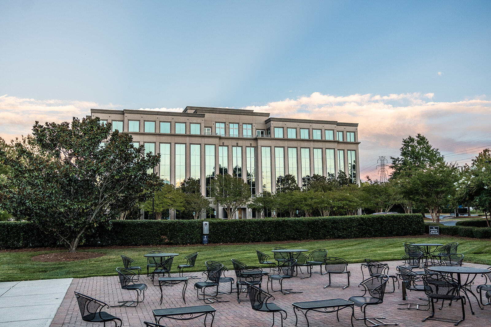 Picnic area and Brixham Green One Building exterior on Ballantyne Campus2