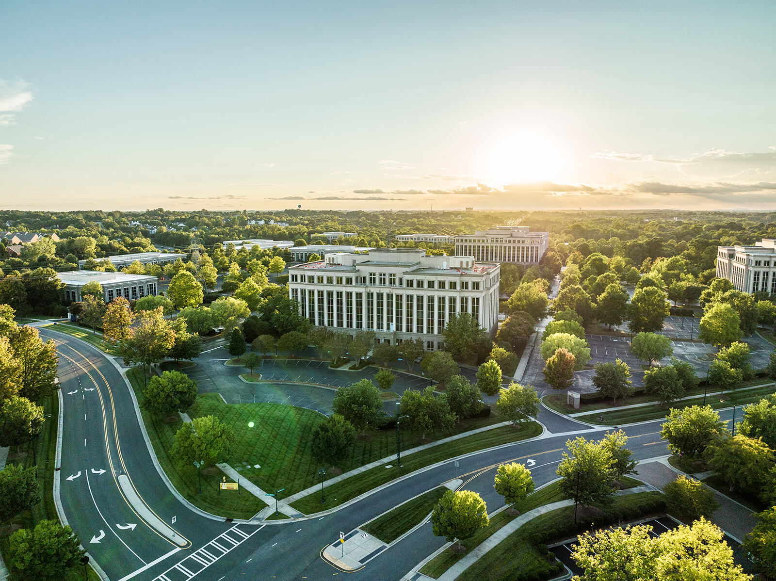Roads and Brixham Green Three Building exterior on Ballantyne Campus at sunset2