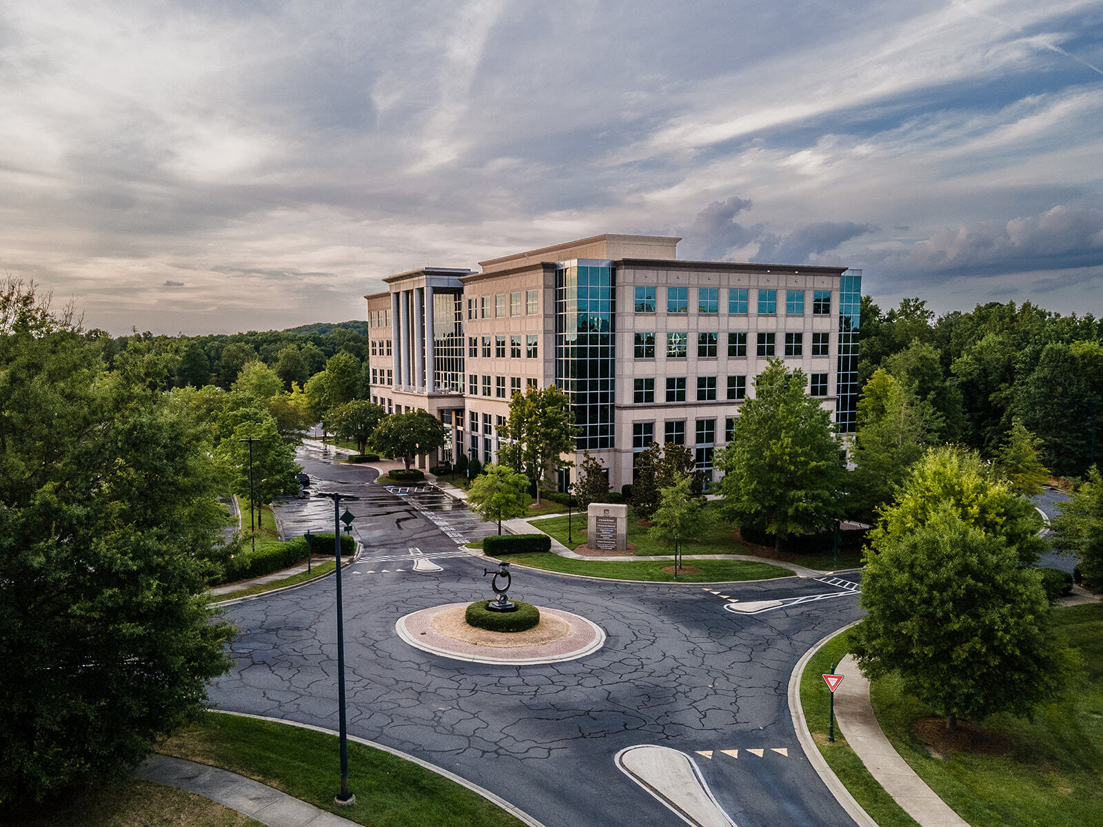 Drone view dusk of roundabout and Crawford Building exterior on Ballantyne Campus2