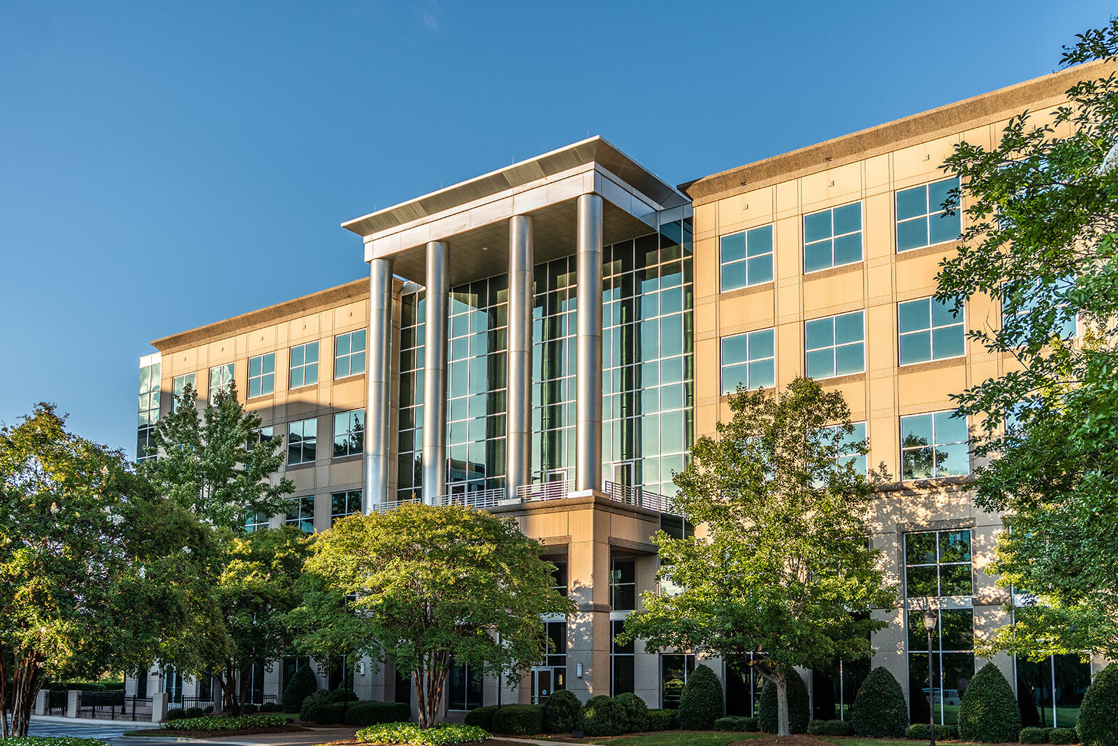 Sunset of Simmons Building exterior on Ballantyne Campus2